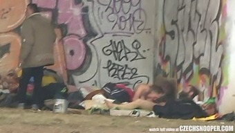 A Threesome Of Homeless Individuals Engaging In Sexual Activity In A Public location, Observed By A Czech Voyeur