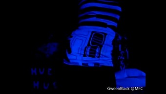 Dancing Provocatively With His Backside Illuminated In Black Light